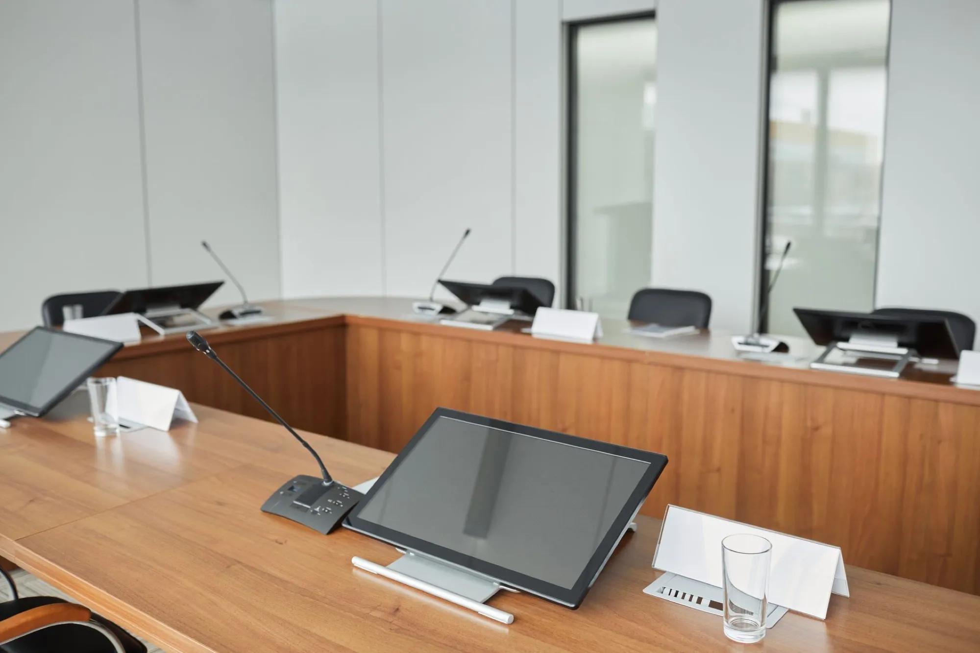 Modern boardroom with a warm wooden conference table